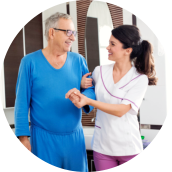 caregiver assisting an elderly man