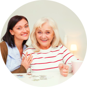 happy elderly woman with her caretaker